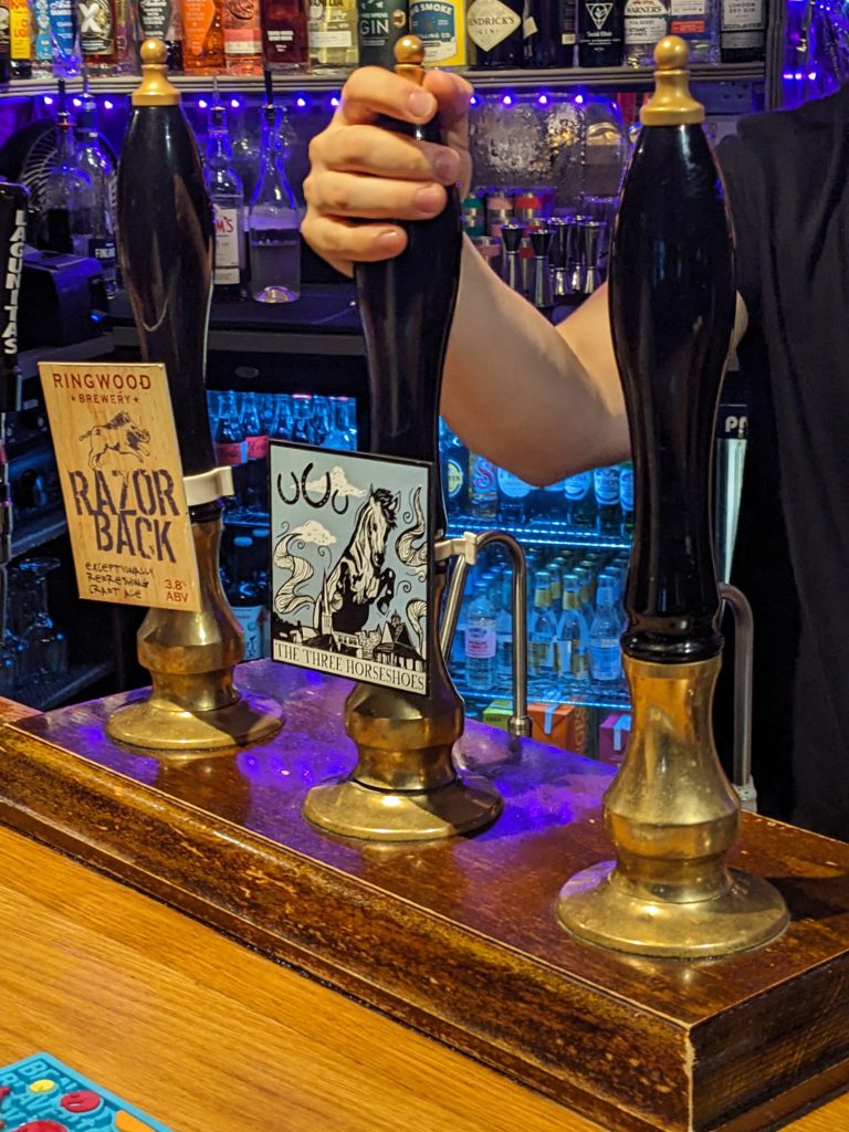 Beer taps at the Three Horseshoes